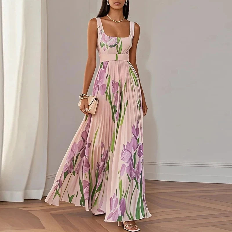 Floral pleated maxi dress in pink and purple, showing fitted bodice and A-line skirt